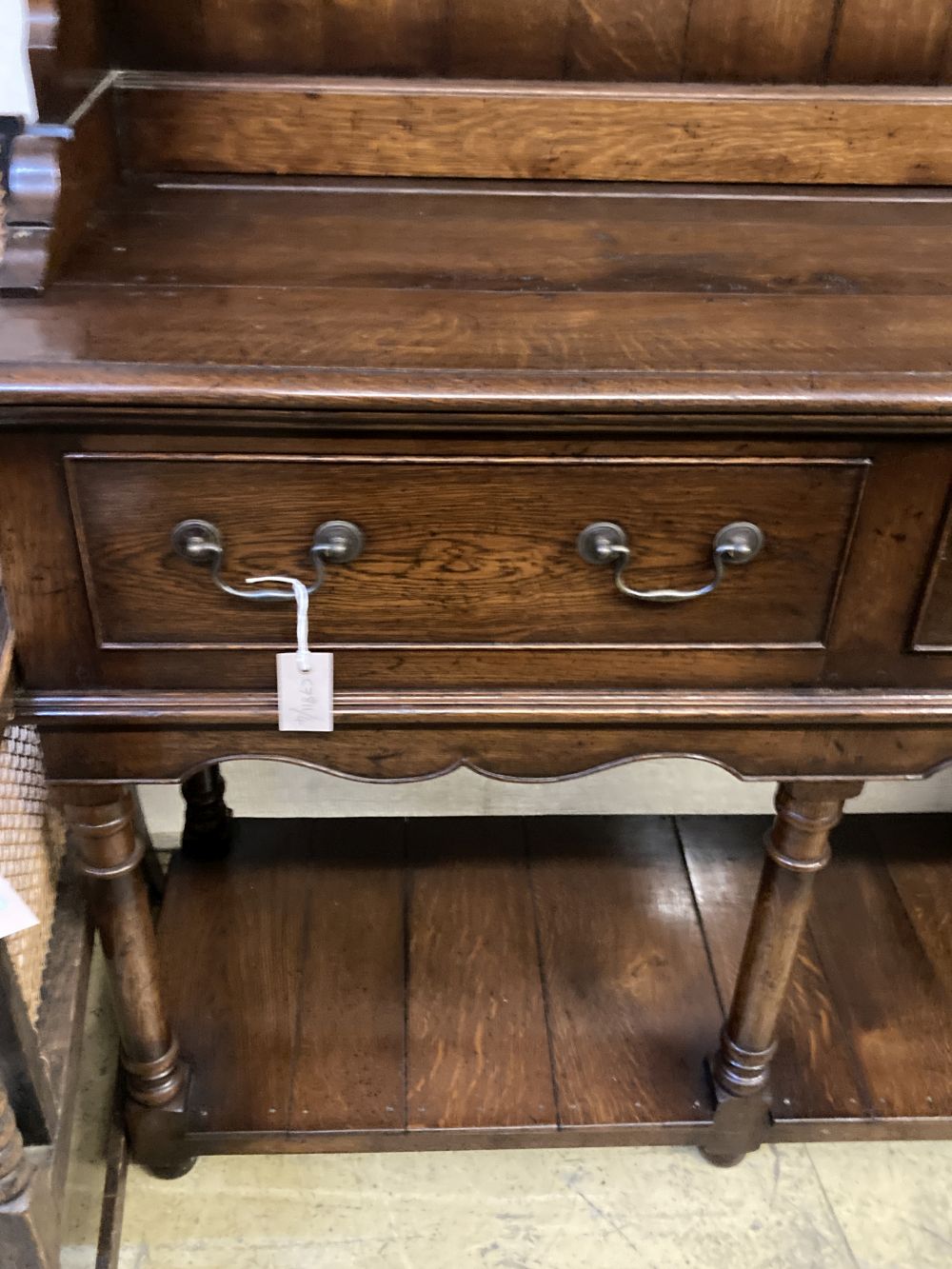 An 18th century style oak dresser, width 182cm depth 45cm height 198cm